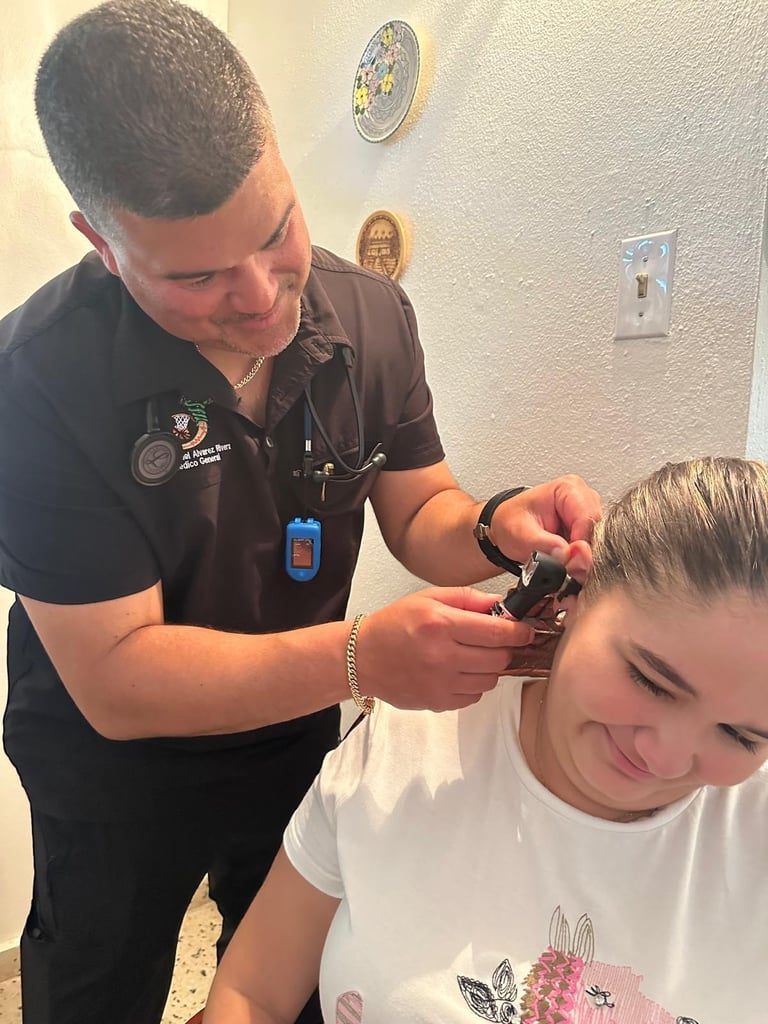 Healthcare provider examining a young childs ear with an otoscope in a clinical setting